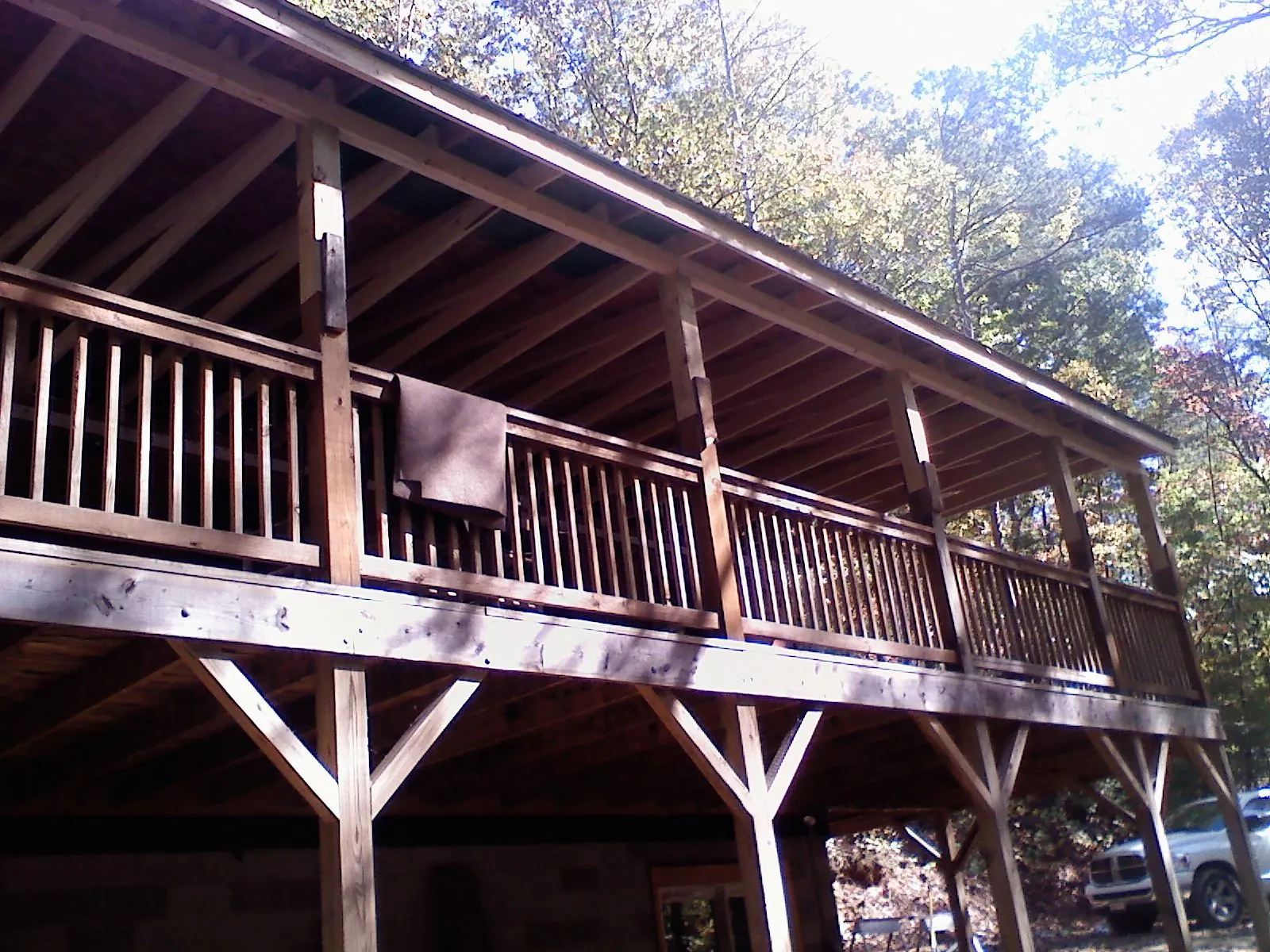 Timber framing under a new elevated porch and deck — Roof Leak Repair in Highland by Roofing Brothers